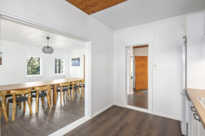 The kitchen in the larger apartment of Räyskälä Rooftop is conveniently located adjacent to the main hall.