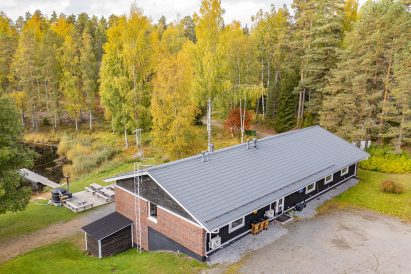 Autumn view from Evo Grand Villa upper yard to Lake Kaitalammi and driveway.