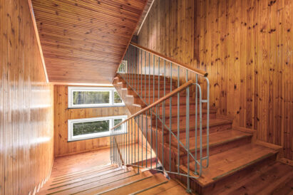 The staircase to the Räyskälä Rooftop captures the unique atmosphere of a historic village schoolhouse.