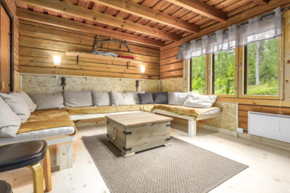 The large room on the ground floor of Evo Wilderness Villa offers a comfortable lounge area with sofas that also serve as extra beds.