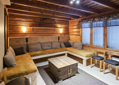 The large room on the ground floor of Evo Wilderness Villa offers a comfortable lounge area with sofas that also serve as extra beds.