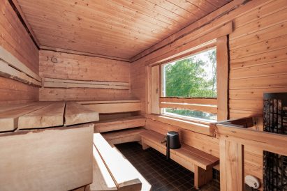 The electric heated sauna room of Aulanko Lakeside's lakefront sauna.