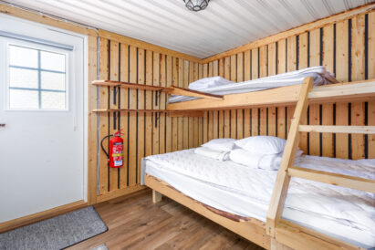 The bedroom at Aulanko Lake Hide-out has sleeping accommodations for 2-3 people.