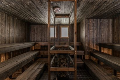 The spacious sauna room of Aulanko Grand Villa's indoor sauna section.