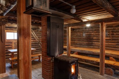 The heat source in Evo Ruuhijärvi's Event Shed is an atmospheric cast iron stove.