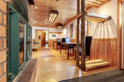 The lobby area of the main building at Evo Ruuhijärvi is cozy and decorated in a wilderness theme.