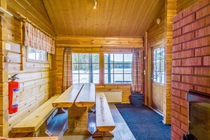 From the dressing room of Evo Syväjärvi's sauna building, there is a view over the terrace to the lake.