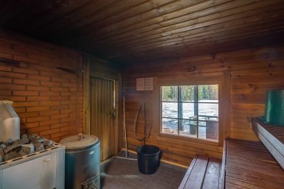 The spacious hot room of Evo Syväjärvi's traditional wood-heated sauna.