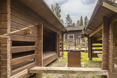 A wilderness-style lean-to shelter and a campfire site are located on the grounds of Evo Wilderness Villa.