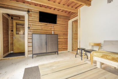 The large downstairs room at Evo Wilderness Villa offers a comfortable lounge area that can also be used as a group workspace for meetings.
