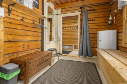 The dressing room of the indoor sauna area at Evo Wilderness Villa, which has its own refrigerator.