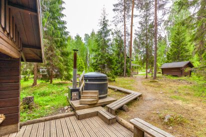 In front of Evo Wilderness Villa's wood-heated outdoor sauna is another of the wood-heated hot tubs.
