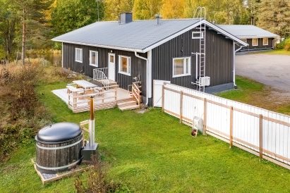 Evo Lakeside Villa, part of Evo Twin, and the shared wood-heated hot tub for both Evo Twin villas.