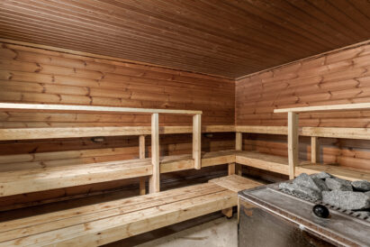 The atmospheric hot room of the wood-heated outdoor sauna at Tavastia Privacy.