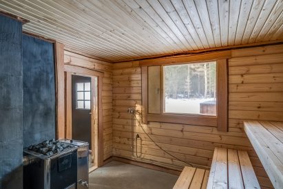 The atmospheric hot room of the wood-heated outdoor sauna at Tavastia Privacy.