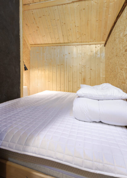 Sleeping alcove with a double bed on the upper floor of Tavastia Privacy.