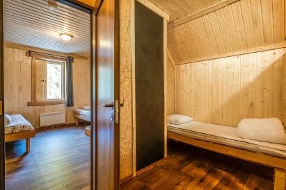 Between the upstairs bedrooms at Tavastia Privacy, there is a comfortable sleeping alcove.
