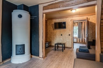 Adjacent to the main hall at Tavastia Privacy, there is a cozy cabin with a sofa that can also be used as a bed.