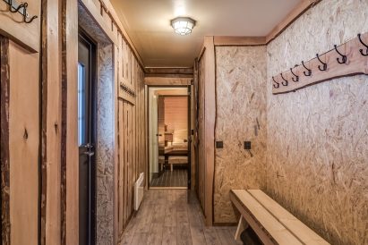 The dressing room of the indoor sauna section at Tavastia Privacy, with direct access to the covered outdoor terrace and the warmth of the hot tub.