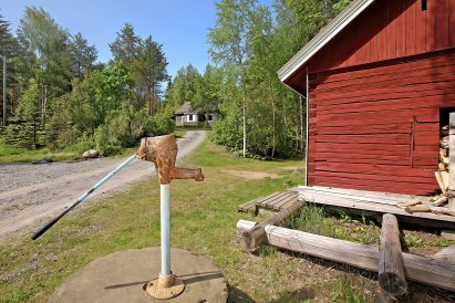 The old log outbuildings at Tavastia Privacy evoke the area's past as a traditional Tavastia farm.