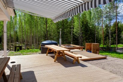 View from terrace to wood-heated tub and fireplace of Villa Springrock.