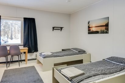 The 3-person bedroom opposite the living kitchen in the middle of Räyskälä Grand Villa.