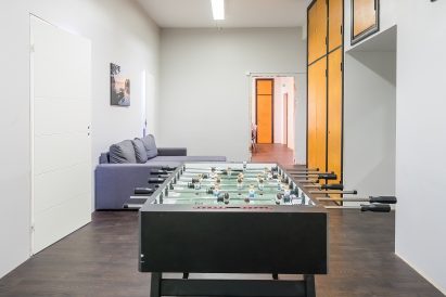 Another game lounge on the ground floor of Räyskälä Grand Villa. The sofa can be used as an additional bed if needed.