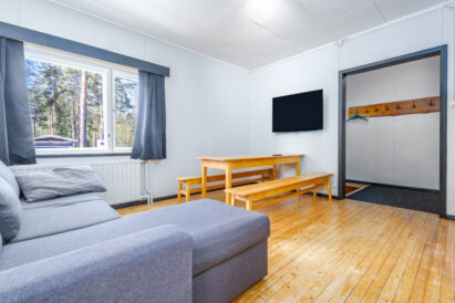 The living room of the west wing corner apartment at Räyskälä Grand Villa. The apartment is available for rent at an additional cost or separately.