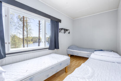 Triple bedroom (Room 9) at Räyskälä Grand Villa.